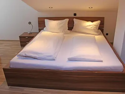 Ein Bett oder Betten in einem Zimmer der Unterkunft Ferienwohnung Kohlstatt