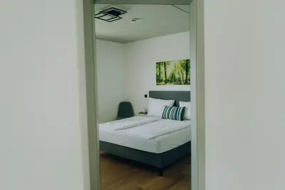 Ein Bett oder Betten in einem Zimmer der Unterkunft Neubau Grüner Wolpertinger Designwhg 106qm Barrierefrei