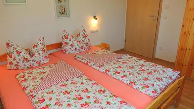 Ein Bett oder Betten in einem Zimmer der Unterkunft Ferienwohnung Zum Wiham