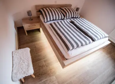 Ein Bett oder Betten in einem Zimmer der Unterkunft Hirsch Chalet #Sauna