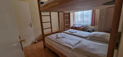 Ein Bett oder Betten in einem Zimmer der Unterkunft ciao-aschau Haus zur Burg Ap104 Pabst
