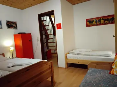 Ein Bett oder Betten in einem Zimmer der Unterkunft ciao-aschau Sachrang Haus Spitzstein FeWo Angelika