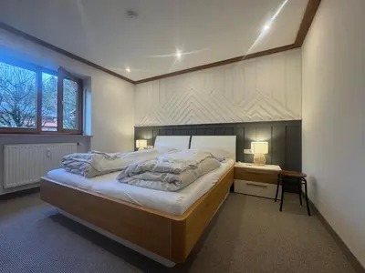 Ein Bett oder Betten in einem Zimmer der Unterkunft ciao-aschau Grenzhub FeWo 206 Puhlmann
