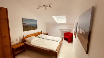 Ein Bett oder Betten in einem Zimmer der Unterkunft ciao-aschau Gschwendtnerhof Ap21 Kappes