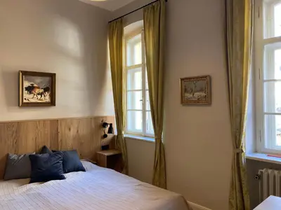 Ein Bett oder Betten in einem Zimmer der Unterkunft ciao-aschau Haus zur Burg Ap112 Burgblick