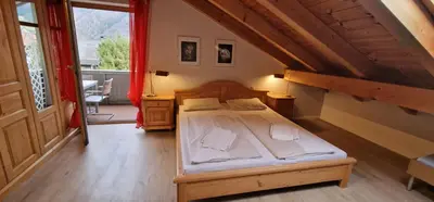 Ein Bett oder Betten in einem Zimmer der Unterkunft ciao-aschau FeWo Bergsonne Kurtenbach
