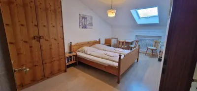 Ein Bett oder Betten in einem Zimmer der Unterkunft ciao-aschau Gschwendtnerhof Ap18 SchölzkeV