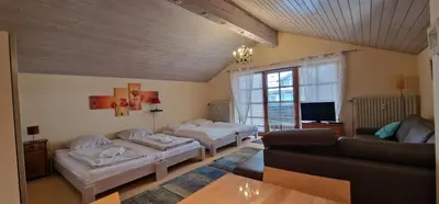 Ein Bett oder Betten in einem Zimmer der Unterkunft ciao-aschau FeWo Schöne-Aussicht