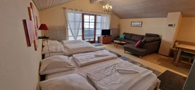 Ein Bett oder Betten in einem Zimmer der Unterkunft ciao-aschau FeWo Schöne-Aussicht