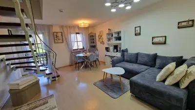 Ein Sitzbereich in der Unterkunft ciao-aschau Gschwendtnerhof Ap19 SchölzkeM