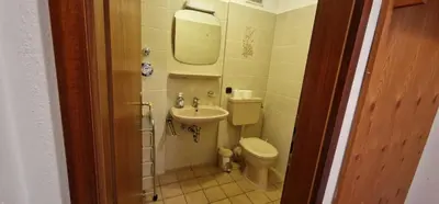 Ein Badezimmer in der Unterkunft ciao-aschau Gschwendtnerhof Ap19 SchölzkeM
