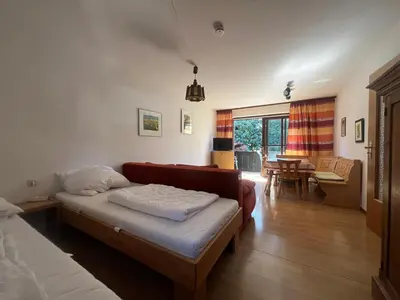 Ein Bett oder Betten in einem Zimmer der Unterkunft ciao-aschau FeWo Fey