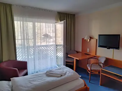 Ein Bett oder Betten in einem Zimmer der Unterkunft ciao-aschau Haus zur Burg Apn220 Mina