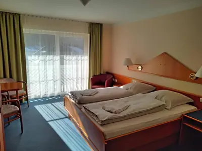 Ein Bett oder Betten in einem Zimmer der Unterkunft ciao-aschau Haus zur Burg Ap233 Julia