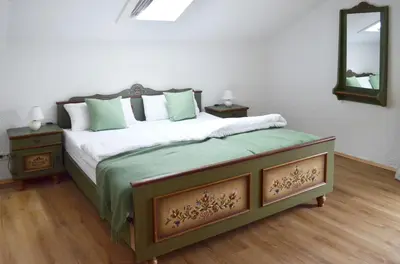 Ein Bett oder Betten in einem Zimmer der Unterkunft Ferienhaus Antdorfer Gartenglück