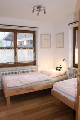 Ein Bett oder Betten in einem Zimmer der Unterkunft Ferienwohnung Geigelsteinblick