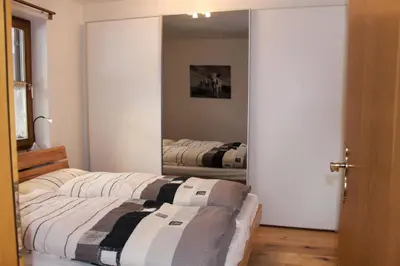 Ein Bett oder Betten in einem Zimmer der Unterkunft Ferienwohnung Geigelsteinblick