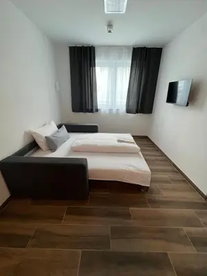 Ein Bett oder Betten in einem Zimmer der Unterkunft Boardinghouse MDS
