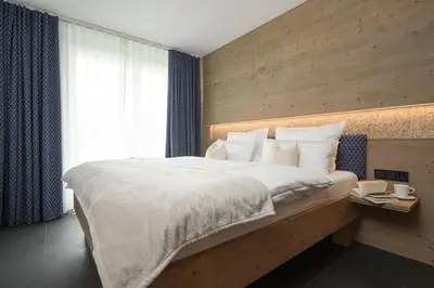 Ein Bett oder Betten in einem Zimmer der Unterkunft Maisonette-Apartment Das Garmisch mit Whirlpool