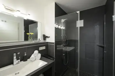 Ein Badezimmer in der Unterkunft Maisonette-Apartment Das Garmisch mit Whirlpool