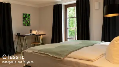 Ein Bett oder Betten in einem Zimmer der Unterkunft Blyb Hotel