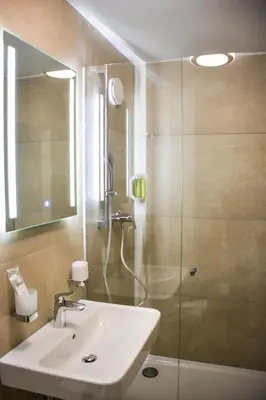 Ein Badezimmer in der Unterkunft Hotel Pame Grill