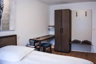 Ein Bett oder Betten in einem Zimmer der Unterkunft Hotel Pame Grill