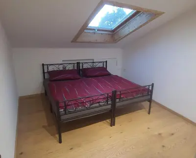 Ein Bett oder Betten in einem Zimmer der Unterkunft Sigrids Ferienwohnung Bad Tölz