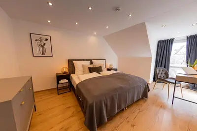 Ein Bett oder Betten in einem Zimmer der Unterkunft BONNYSTAY Landshut Monument
