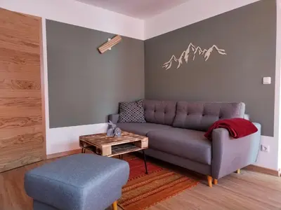 Ein Sitzbereich in der Unterkunft Ferienwohnung am Gänsbach
