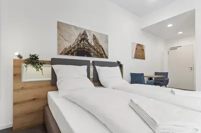 Ein Bett oder Betten in einem Zimmer der Unterkunft Flatista Homes - Aubing