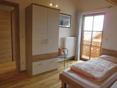Ein Bett oder Betten in einem Zimmer der Unterkunft Landhaus Familie Doll Ferienwohnung Sunnawind