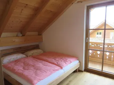 Ein Bett oder Betten in einem Zimmer der Unterkunft Landhaus Familie Doll Ferienwohnung Sunnawind