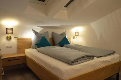 Ein Bett oder Betten in einem Zimmer der Unterkunft Ferienwohnung am Lech - Heidrun s Nest