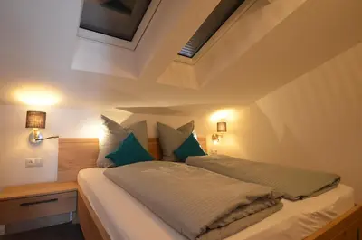 Ein Bett oder Betten in einem Zimmer der Unterkunft Ferienwohnung am Lech - Heidrun s Nest