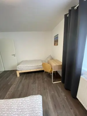 Ein Bett oder Betten in einem Zimmer der Unterkunft Unterkunft für Arbeiter und Monteure