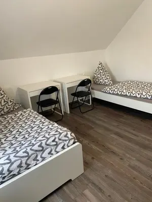 Ein Bett oder Betten in einem Zimmer der Unterkunft Unterkunft für Arbeiter und Monteure