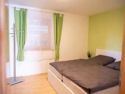 Ein Bett oder Betten in einem Zimmer der Unterkunft NEU! Ferienwohnung Steffi nahe Chiemsee