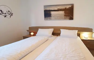 Ein Bett oder Betten in einem Zimmer der Unterkunft Ferienwohnungen Trattler