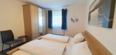 Ein Bett oder Betten in einem Zimmer der Unterkunft Ferienwohnungen Trattler
