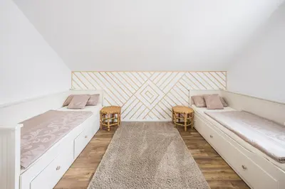 Ein Bett oder Betten in einem Zimmer der Unterkunft Ferienwohnung am Park in Schwabmünchen