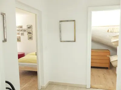 Ein Bett oder Betten in einem Zimmer der Unterkunft Gartenstudio-Apartment Tausendfreund - adults only - am Chiemsee