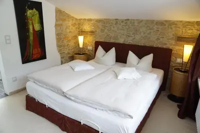 Ein Bett oder Betten in einem Zimmer der Unterkunft Hotel Alpenhof Bayrischzell