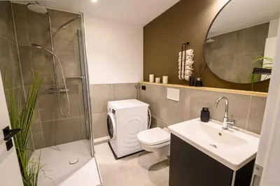 Ein Badezimmer in der Unterkunft OrangeHome Design Apartment zwischen See & Zentrum