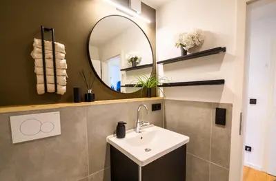 Ein Badezimmer in der Unterkunft OrangeHome Design Apartment zwischen See & Zentrum
