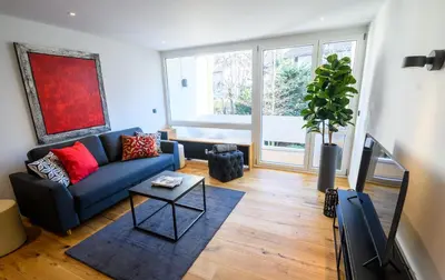 Ein Sitzbereich in der Unterkunft OrangeHome Design Apartment zwischen See & Zentrum