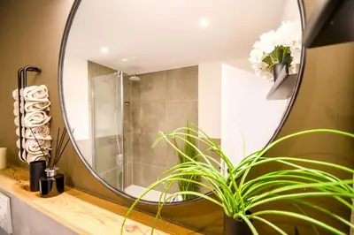 Ein Badezimmer in der Unterkunft OrangeHome Design Apartment zwischen See & Zentrum