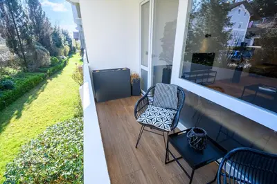 Ein Garten an der Unterkunft OrangeHome Design Apartment zwischen See & Zentrum