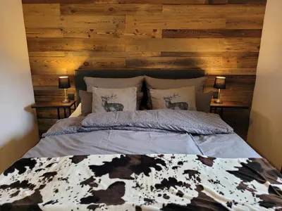 Ein Bett oder Betten in einem Zimmer der Unterkunft Familienfreundliche großzügige Ferienwohnung Schlierachwelle zwischen Schliersee und Tegernsee