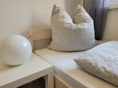 Ein Bett oder Betten in einem Zimmer der Unterkunft Familienfreundliche großzügige Ferienwohnung Schlierachwelle zwischen Schliersee und Tegernsee